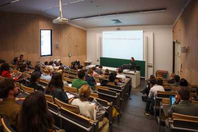 people watching a presentation in an auditorium